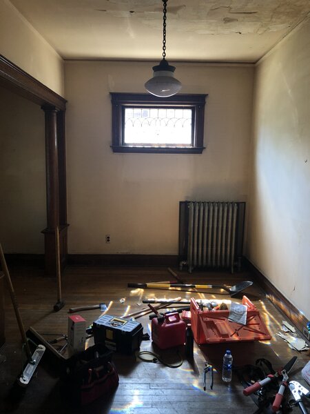 Before: Since the home is located in a historic district, the couple needed to save many of the windows. 
