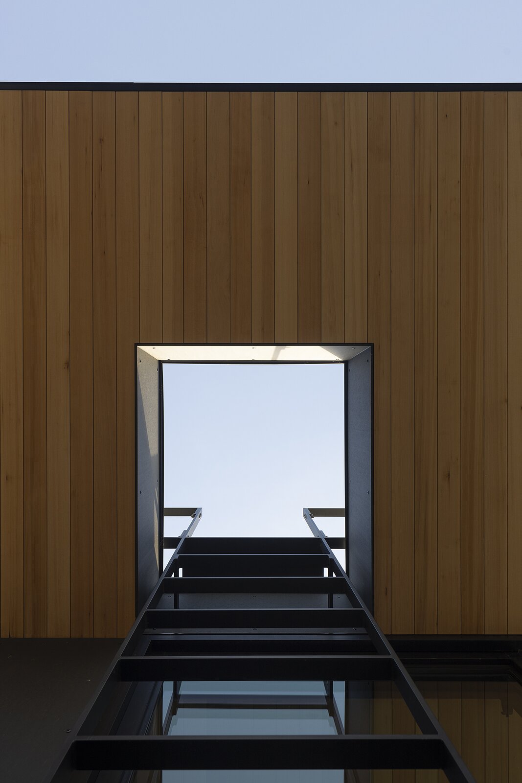 Custom steel ladders and guardrails, painted Benjamin Moore ‘Onyx,