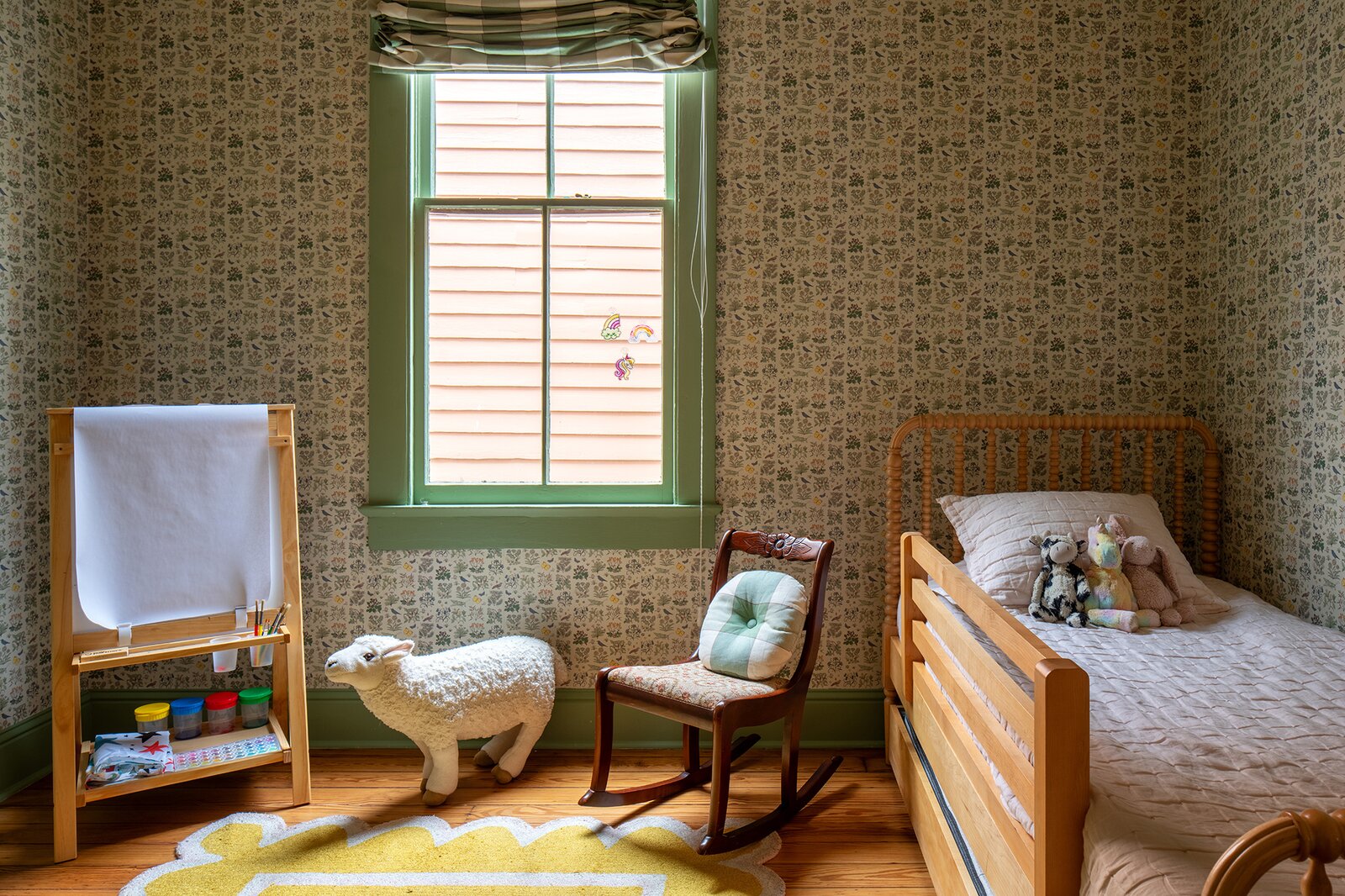 Lighting and wallpaper were budget splurges that bring the entire house's design together, says Kara. Here, House of Hackney wallpaper joins Farrow &amp; Ball Calke Green paint.