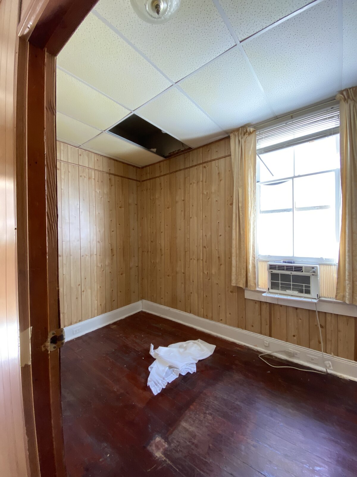 Before: A small bedroom was converted into the kitchen. Existing windows were relocated to other places in the home, and the dropped ceiling removed to reveal the room’s full height of 12-foot-6.