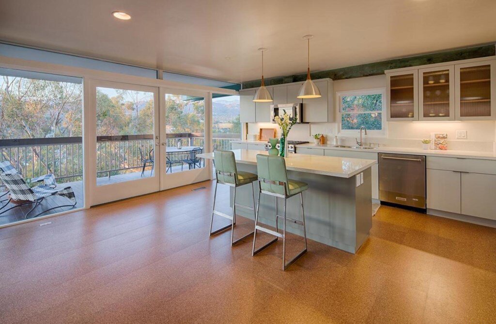 Before: The kitchen had Ikea cabinets and the original cork floors.