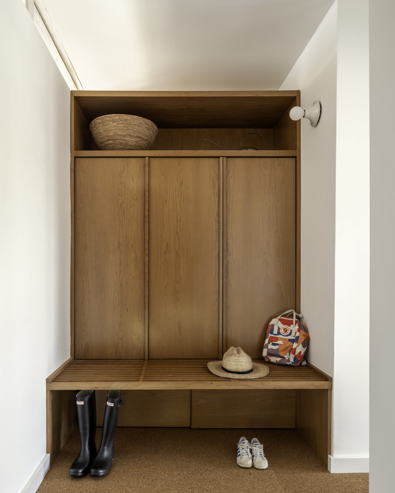 Mudroom cabinetry creates consistency with the rest of the house.