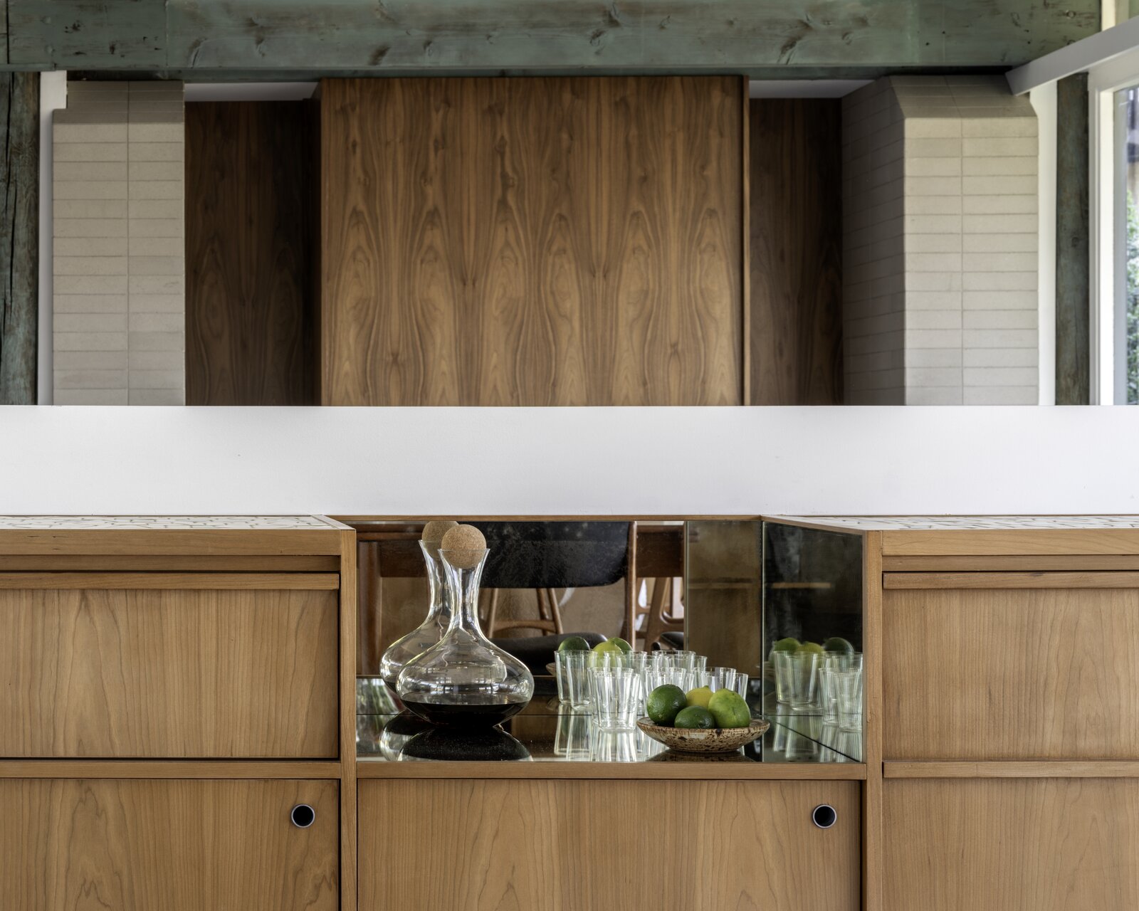 A smoked glass cut-out forms a bar.