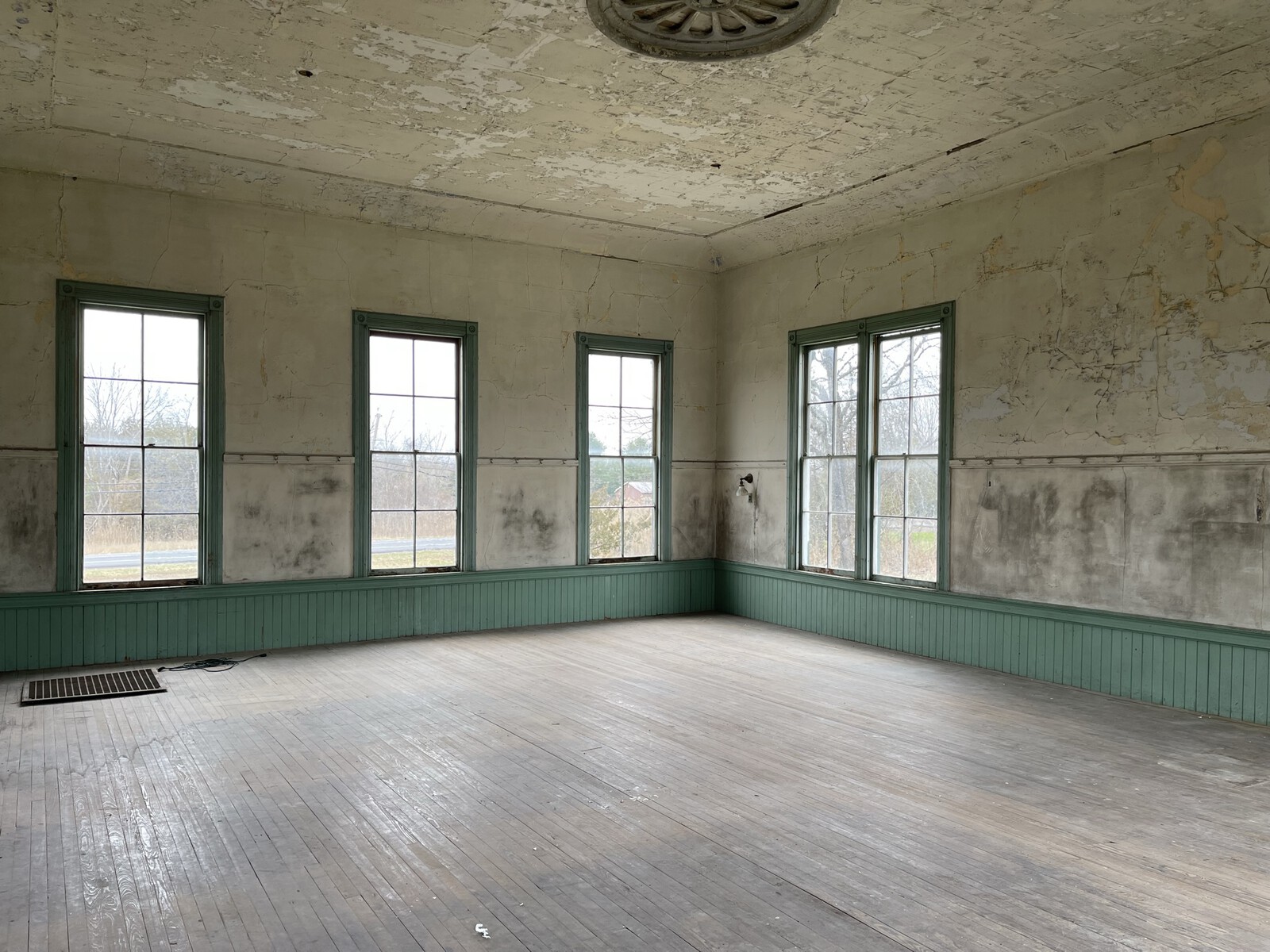 Before: It was still possible to see the blackboard on the wall between the wainscot and coat rail.