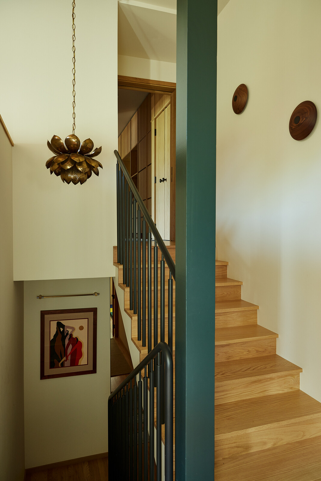 Boy Boy fabricated the new stair rail, which was powder-coated to match the Valspar ‘Black Evergreen’ color used throughout.
