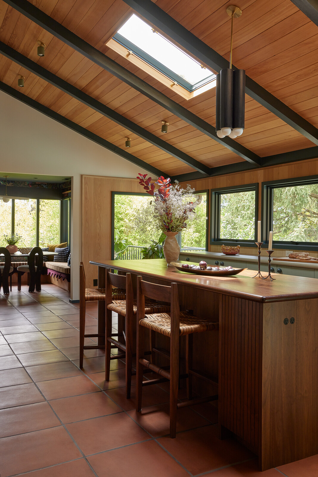 Bright Designlab designed the custom walnut island, fabricated by Maple Key. A Workstead light hangs overhead.