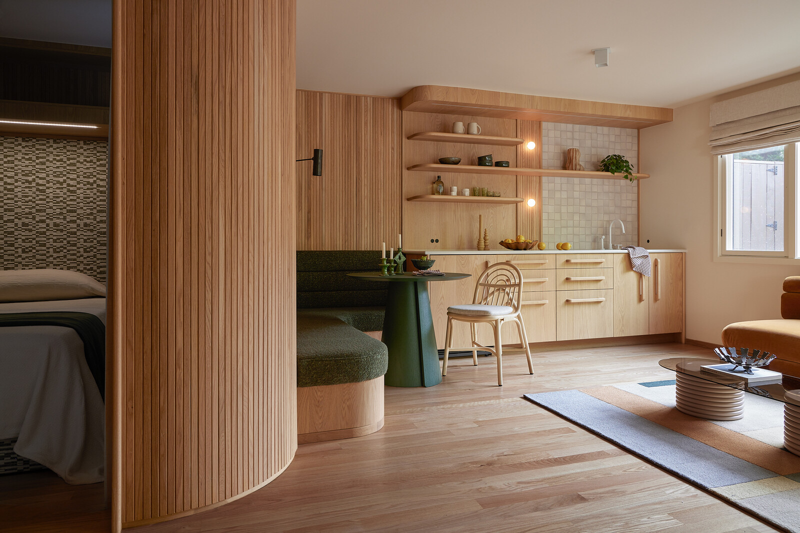 A curving wall swoops around the bedroom.