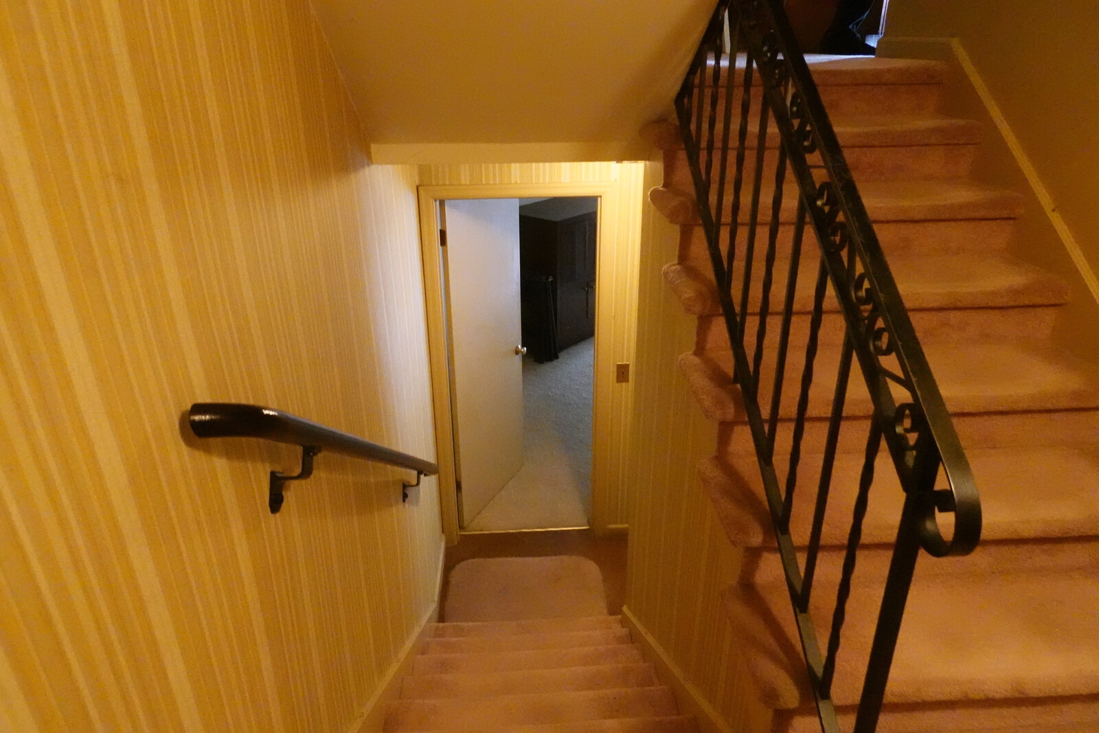 Before: The designers swapped out the carpet and iron railing.