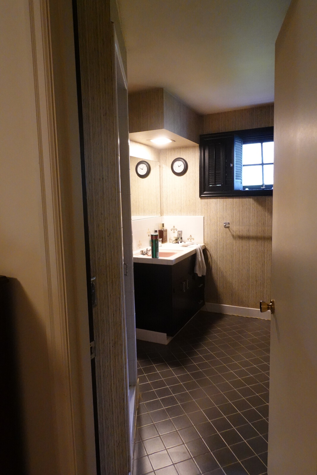 Before: The door to the bathroom was widened and given a custom treatment to be consistent with the built-ins.