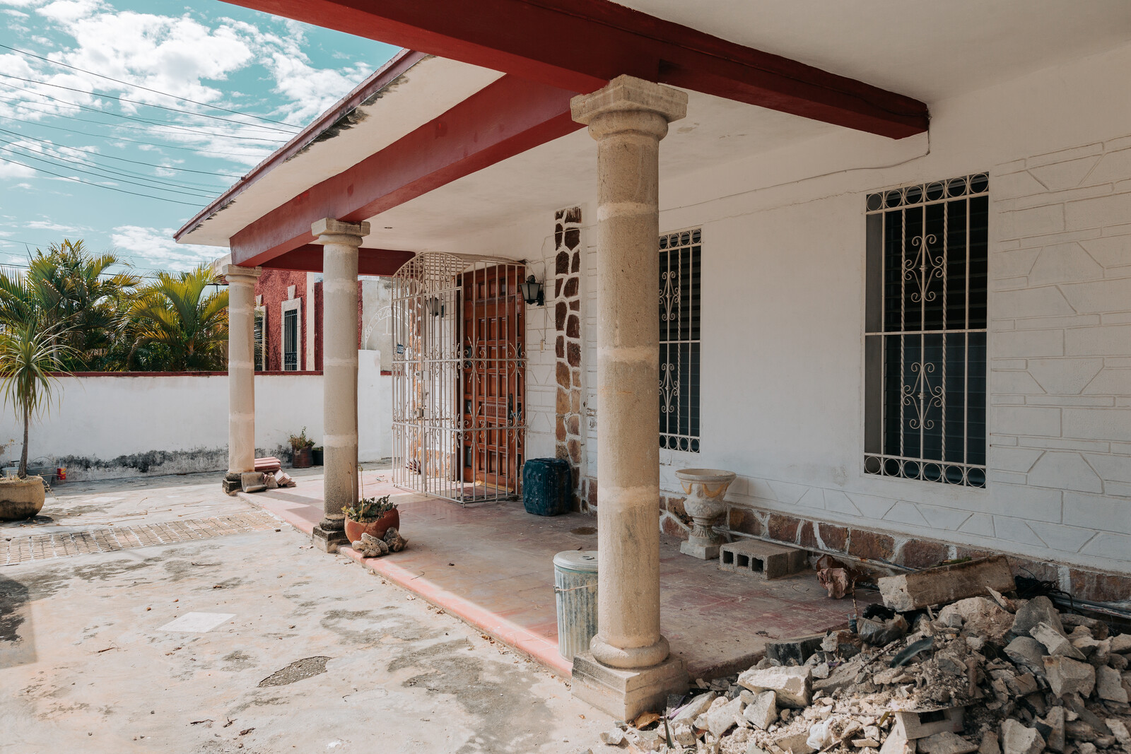 Before: The front porch was removed in order to streamline the front facade, but the home's essential volume was kept. "We were very happy and excited that the owner was really respectful of the context,