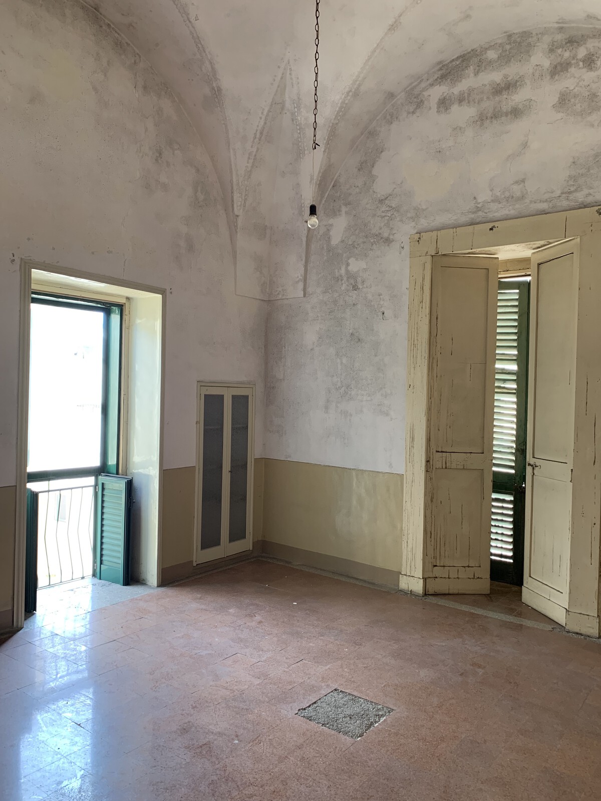 Before: The floors, walls, and ceiling were similarly redone in this room.