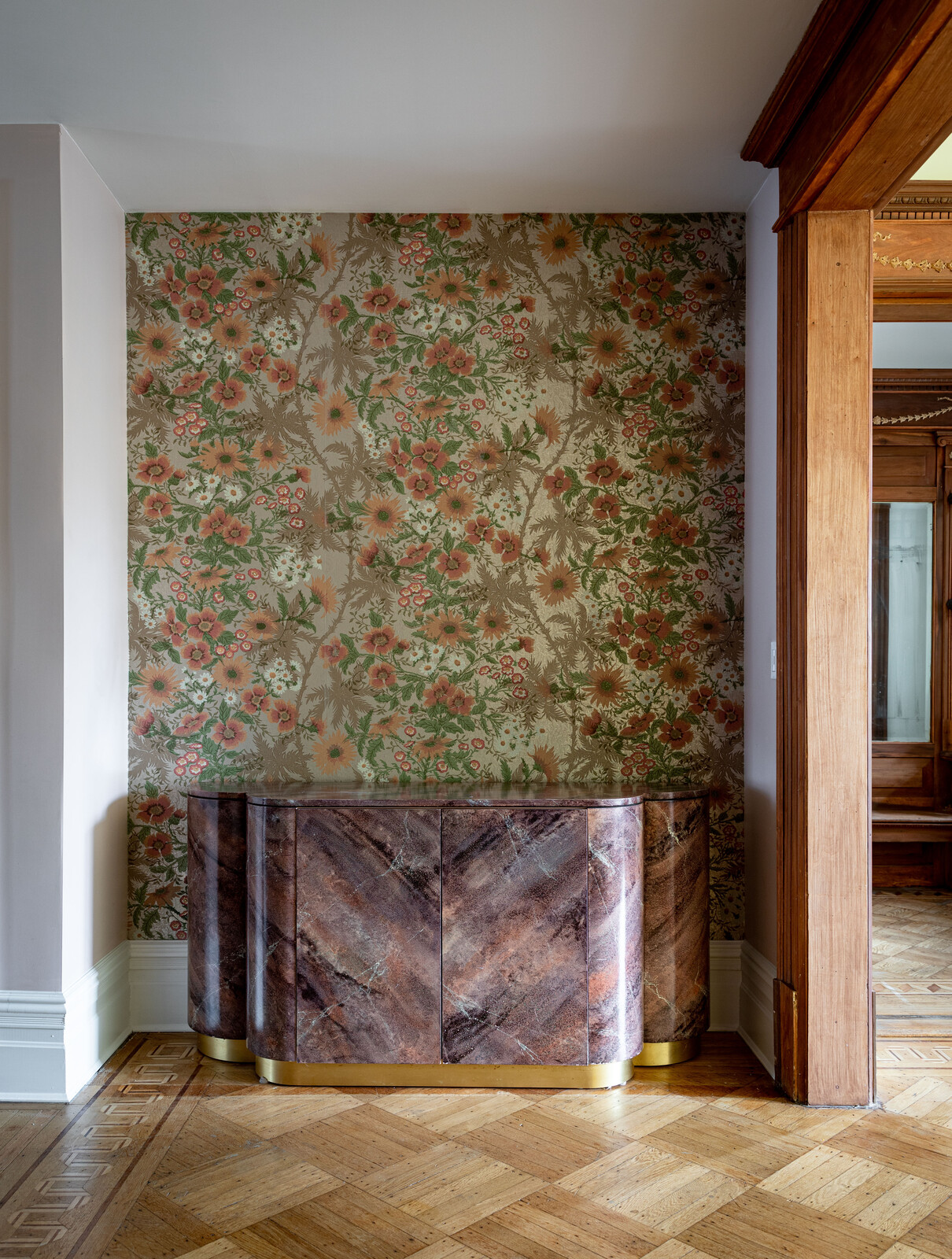 The wallpaper in the niche is a remnant from Laura's childhood home. The paint color is "Tissue Pink