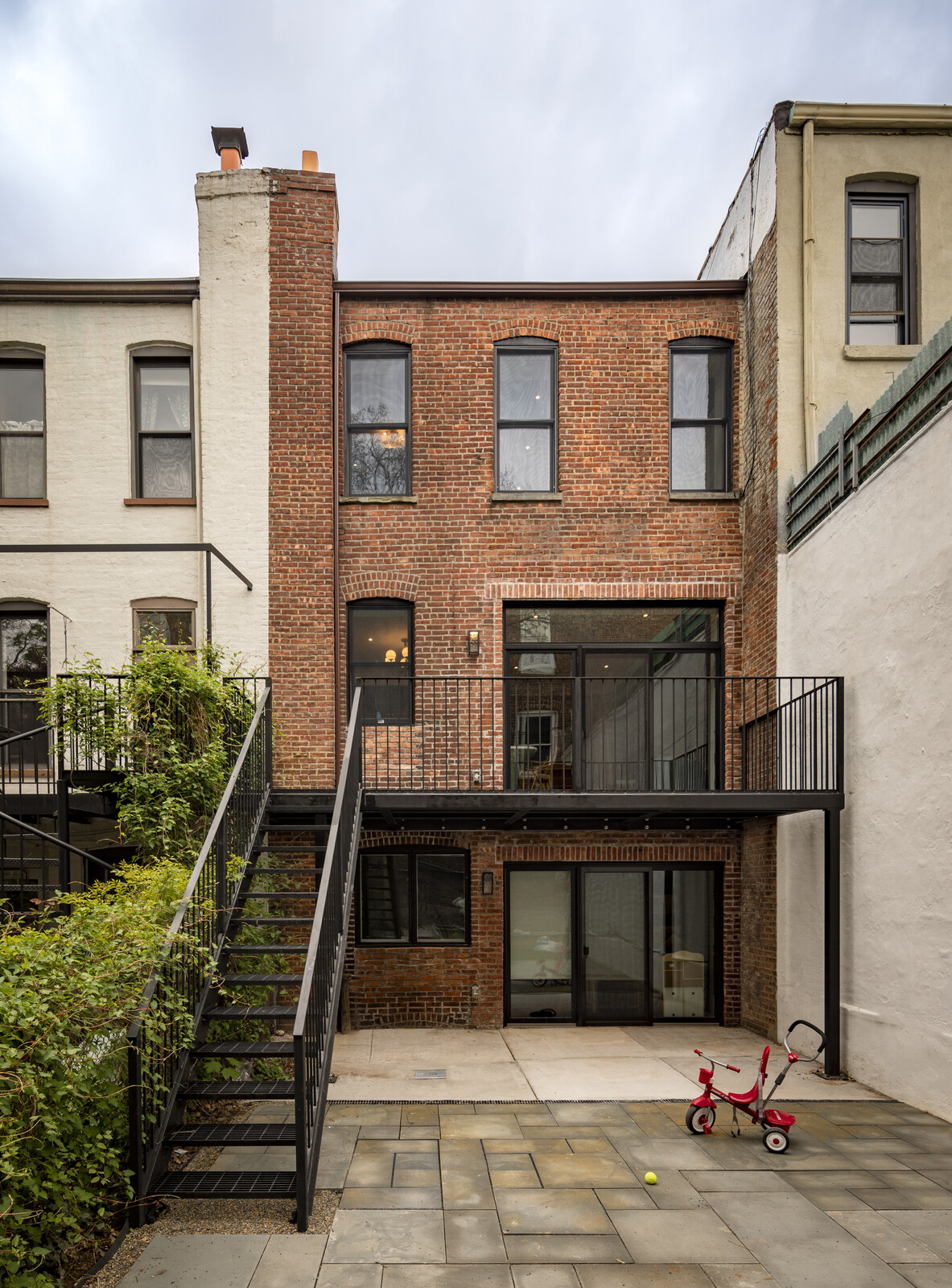 The new doors bring in a lot of natural light and the shared backyard makes it easier to circulate between units.