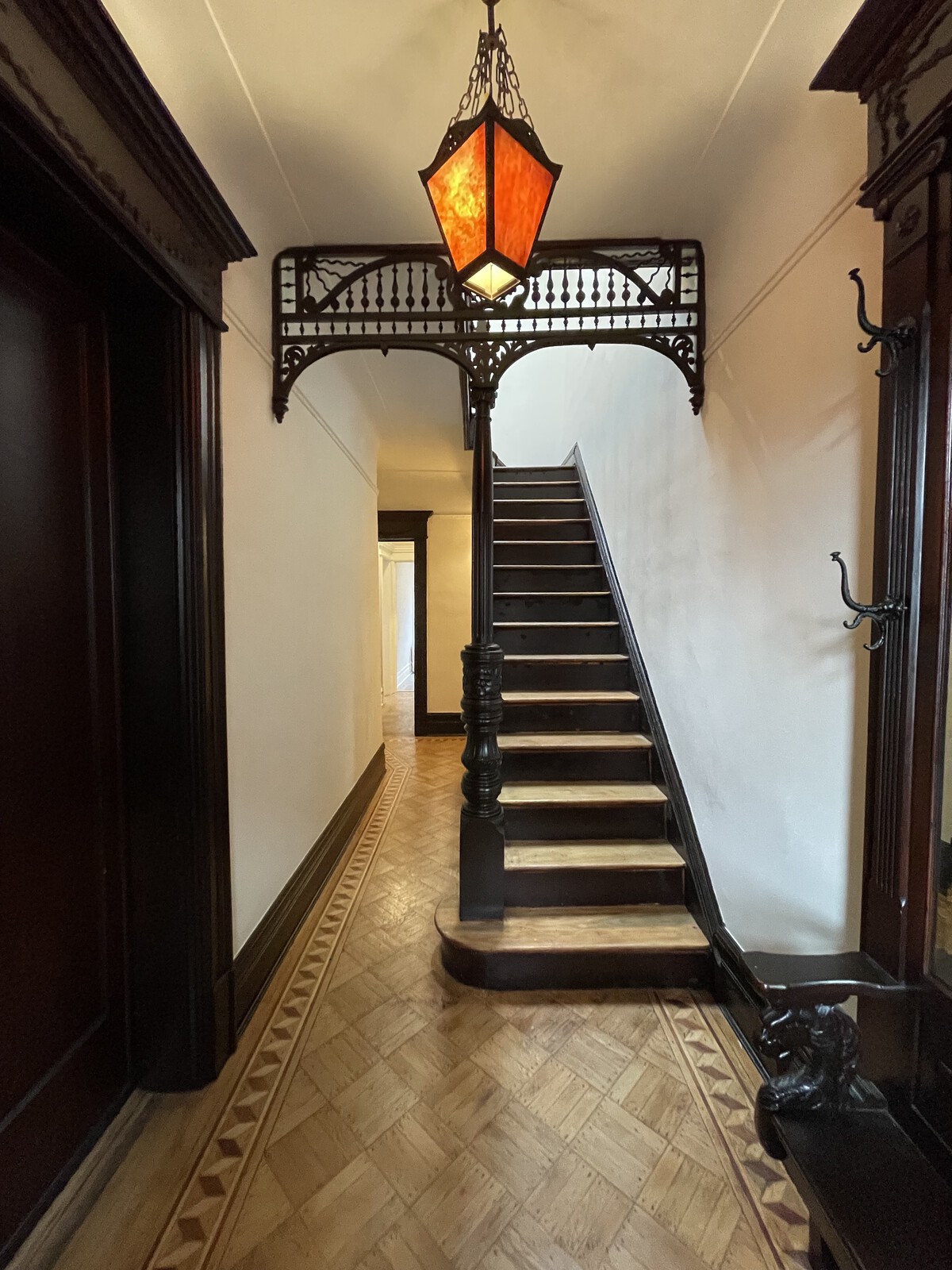 Before: Laura and David (not their real names) were relocating from California to New York City in 2021, and bought this 1910 row house in Brooklyn originally built by William M. Calder. They loved the historic woodwork and aimed to save as much as possible in the renovation.