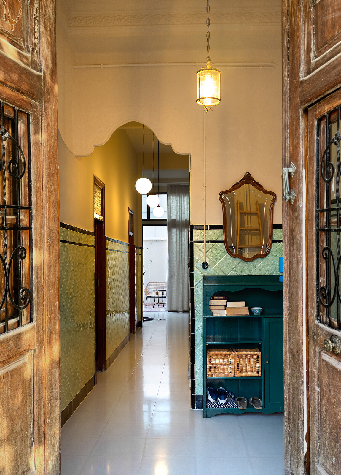 The couple kept and reused many of the old doors, as well as the tile wainscot on most walls.