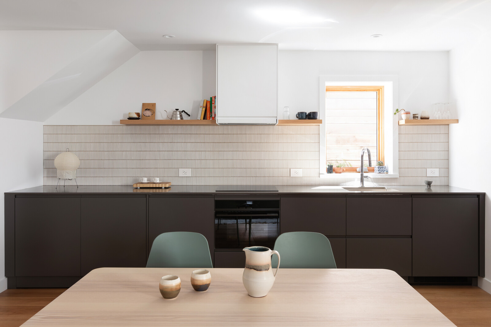 The basement now has a rec room, with a full kitchen, bathroom, and bedroom, and exterior access, so it can function as an independent suite for guests or renters, depending on the couple's needs.