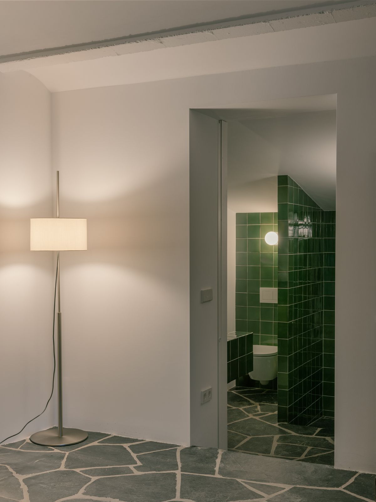 The TMM lamp is by Miguel Milá for Santa&amp;Cole. The green tile in the bathroom is by Ceràmica Ferrés.