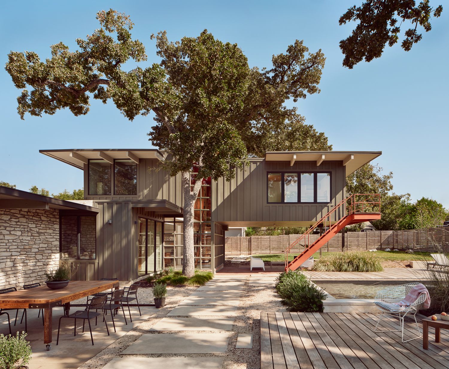 The cantilevered addition was kept, and another bedroom added to the second floor over the existing house. Parks collaborated with Fort Structures to ensure that the third addition would sync with the rest of the house, replicating the window placement to make them sit between the roof beams, while still meeting current code and insulating the ceiling.