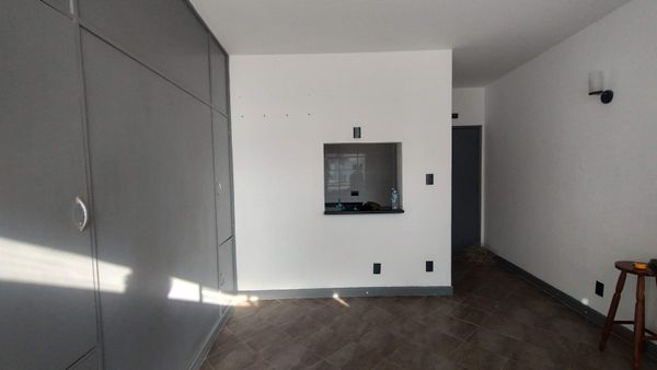 Before: The small, boxed-in kitchen made the adjacent entry feel small.