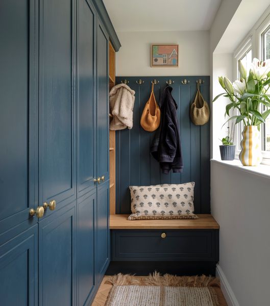 Architect Simon Knight of Simon Knight Architects relocated the kitchen, and placed a boot room in its place. The painted cabinets are from Alban Furniture.