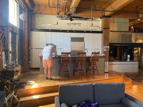 Before: The front door entered into the kitchen on an elevated platform. Both the clients and the design team wanted to make the kitchen the same level as the rest of the living spaces.