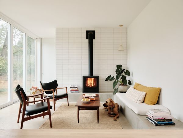 The sunken sunroom has a Rais Q-Tee II Gas fireplace, and a Pigeon Toe Ceramics X Rejuvenation pendant light in the corner.