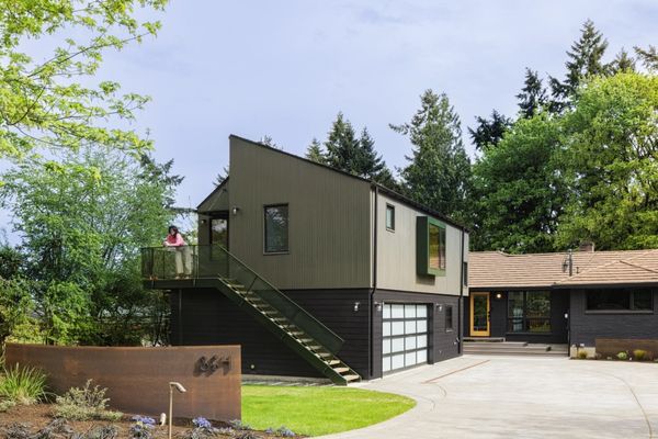 The team rebuilt the garage into a two-level, 1487-square-foot unit. The lower level is a functional garage, while the upper level has a 780-square-foot apartment.