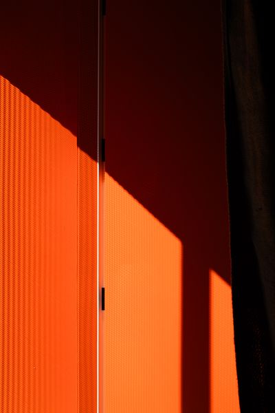 In a nod to the building's previous incarnation and the owner's curiosity, the front door is painted Benjamin Moore Fireball Orange.