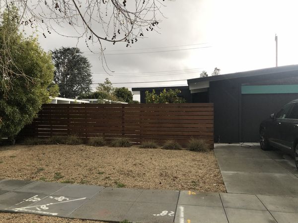 Before: When Kiki Carauta and Alex Nako bought this 1954 Eichler in 2017, it had 1288 square feet, three bedrooms, one bathroom, and a small addition (seen here) in the side yard.