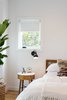 A fireplace and cabinets were removed from the window wall in the new master suite area to create a room large enough for a king size bed. Photo 9 of Chenery Street Remodel modern home