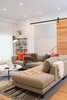Modern home with Interior, Doors, Sliding Door Type, and Wood. Located on the ground floor, the family room has a large barn door that can be closed to create a guest suite for visitors. Photo 10 of Chenery Street Remodel