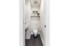 Modern home with Ceramic Tile Floor, Subway Tile Wall, Recessed Lighting, Wall Mount Sink, Bath Room, Ceramic Tile Wall, and One Piece Toilet. The new powder room includes a wall-hung Toto toilet and wall-hung Duravit sink, white subway wall tiles and charcoal gray medium hex floor tiles to create a functional space that feels larger than it is. Photo 6 of 14th Avenue Remodel