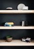 Modern home with Storage Room and Shelves Storage Type. Pine wood shelves that match the flooring with a painted back wall add contrast to the other end of the bedroom. Photo 11 of 21st Street Cottage Remodel
