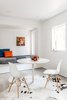 Modern home with Dining Room, Recessed Lighting, Chair, Table, Accent Lighting, Bench, and Concrete Floor. The built-in window seat can double as a guest bed. Photo 6 of 21st Street Cottage Remodel