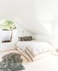 Modern home with Bedroom, Wall Lighting, Recessed Lighting, Light Hardwood Floor, Bed, and Accent Lighting. A cozy and private sleeping nook with beautiful natural light. Photo 10 of 21st Street Cottage Remodel
