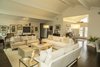 The foyer flows right into the living/dining area welcoming everyone as they join the party. Photo 2 of The R.D. House modern home