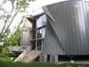 looking NE: curved aluminum tube w/standard HPS flood, lights the deck and yard. best worst spot for condensers since code won’t allow them in the 5’ side yard. Photo 5 of metalHOUSE(2) modern home