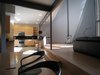 looking E: view from dining room into kitchen. horizontal grain rift oak mdf bd. w/ black granite countertops. Photo 9 of metalHOUSE(2) modern home