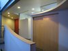 looking NW from the 2nd floor hall: bedroom and study transoms daylight the circulation space adjacent to the solar chimney. HVAC equipment and linen closet are behind the bypass doors. the entry door is below the red wall. Photo 14 of metalHOUSE(2) modern home