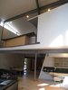 looking NE: MBR on 2nd floor on left. back side of dressers (oak plywood, plastic laminate tops, perforated aluminum) form rail. MBR bath to the right of the dressers. Photo 11 of metalHOUSE(2) modern home