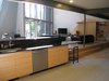 looking SW from kitchen: entertainment center (oak doors, oak plywood, plastic laminate tops, perforated aluminum) is on right.
Photo 12 of metalHOUSE(2) modern home