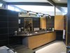 looking SW from the MBR bath: horizontal grain rift oak cabinets w/wood boxes. black granite tops, bracketed tracklighting. 12 x 24 porcelain ceramic tile.
Photo 16 of metalHOUSE(2) modern home