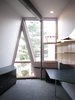 looking E from julia’s bedroom: left wall and “A” window slope out. steel threaded rod w/bracket suspended shelving system above the desk. this system was used in all the bedroom’s, elaine’s study, and closet interiors. the desk top is mdf board w/plastic laminate supported by a purchased pedestal unit and chrome closet rod leg. Photo 17 of metalHOUSE(2) modern home