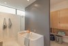 Modern home with Bath Room, Freestanding Tub, and Porcelain Tile Wall. Master Bathroom Photo 10 of Pavilion Haus