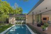 Modern home with Outdoor, Back Yard, Swimming Pools, Tubs, Shower, Small Pools, Tubs, Shower, Concrete Pools, Tubs, Shower, Large Patio, Porch, Deck, Decking Patio, Porch, Deck, and Horizontal Fences, Wall. Backyard Photo 12 of Pavilion Haus