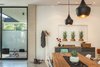 Modern home with Dining Room, Chair, Table, Ceiling Lighting, Accent Lighting, Recessed Lighting, Pendant Lighting, and Concrete Floor. Dining Room Photo 6 of Pavilion Haus