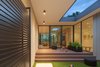 Modern home with Outdoor, Grass, Wood Patio, Porch, Deck, Pavers Patio, Porch, Deck, Concrete Patio, Porch, Deck, Front Yard, and Walkways. Entry Courtyard Photo of Pavilion Haus
