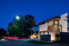 Modern home with Exterior, Wood Siding Material, Brick Siding Material, House Building Type, Stucco Siding Material, and Glass Siding Material. Exterior front elevation Photo of Gibson Residence