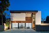 Modern home with Exterior, Brick Siding Material, House Building Type, Wood Siding Material, Stucco Siding Material, and Glass Siding Material. Front facade Photo 2 of Gibson Residence