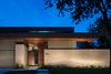 Modern home with Exterior, House Building Type, Flat RoofLine, Brick Siding Material, and Wood Siding Material. Exterior View Photo of McClendon Residence